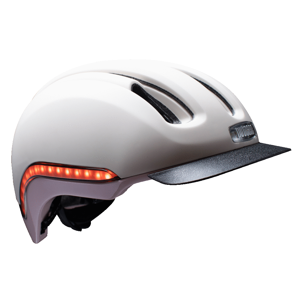 Nutcase Vio Rozay Matte Adult helmet with MIPS, 200 lumens front LED headlight, 65 lumens side and rear LED lights, reflective print, magnetic buckle for easy on and off, dial adjustable for individualized fit and comfort, duo layer foam construction with denser outer layer and softer inner layer, and removable visor