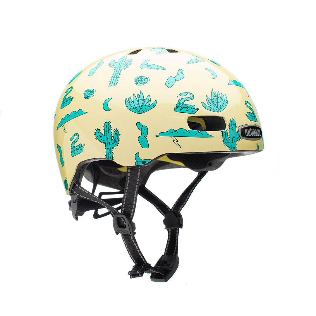Nutcase Street Collection Coachelmet Gloss Adult helmet with industry leading safety feature MIPS, reflective print, magnetic buckle for easy on and off, Internal heat sealed pads to provide comfort, dial adjustable fit system for individualized fit and comfort, and removable visor.