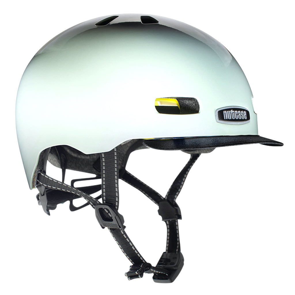 Nutcase Street Collection City of Pearls Pearl Adult helmet with industry leading safety feature MIPS, reflective print, magnetic buckle for easy on and off, Internal heat sealed pads to provide comfort, dial adjustable fit system for individualized fit and comfort, and removable visor.